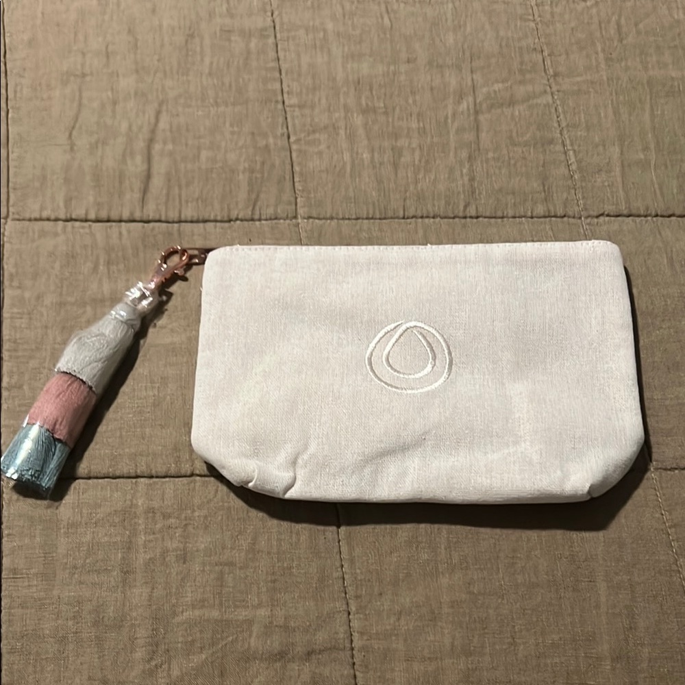 MONAT Cream Pouch with Tassel. New.